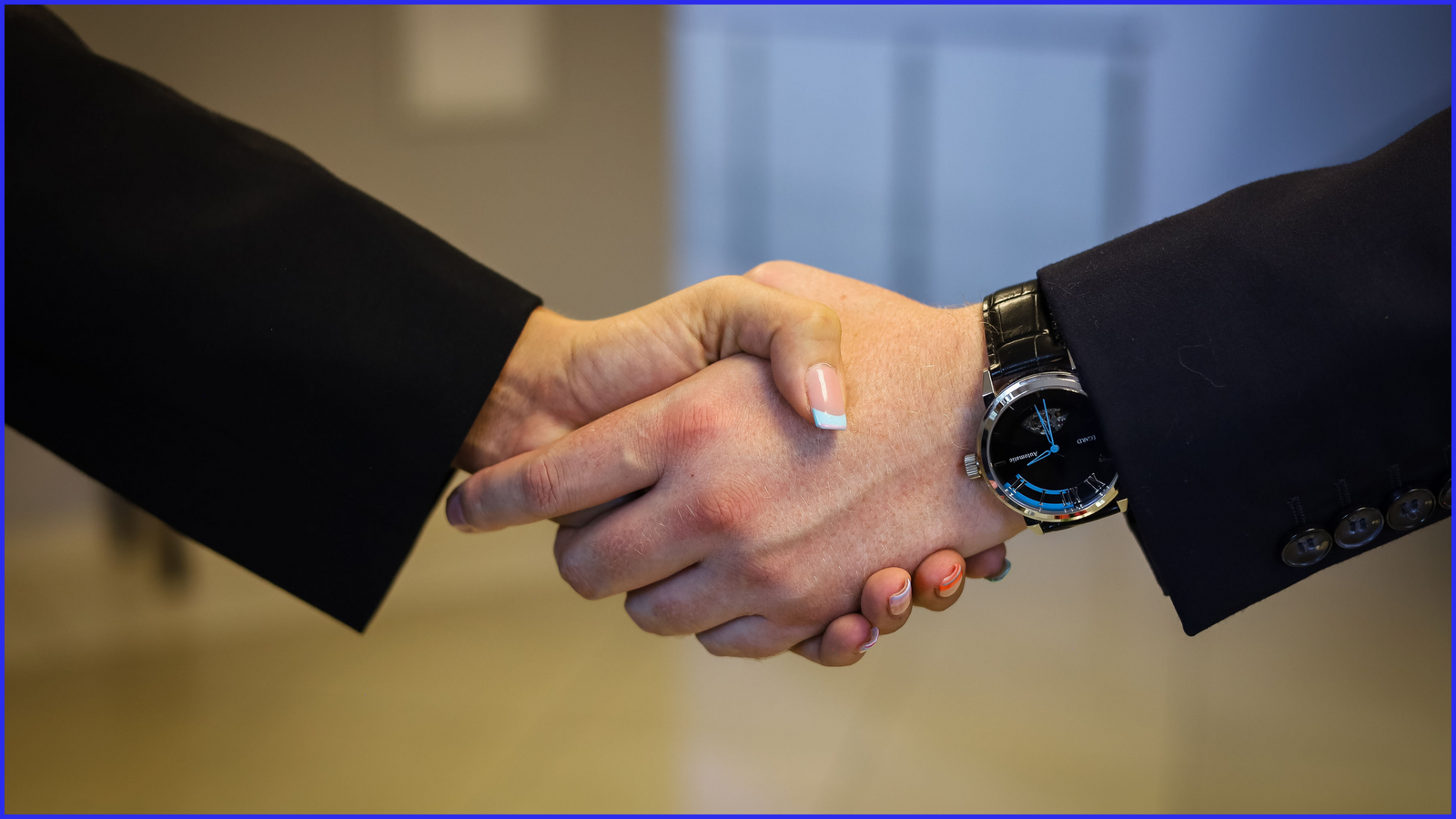 Two business people shaking hands