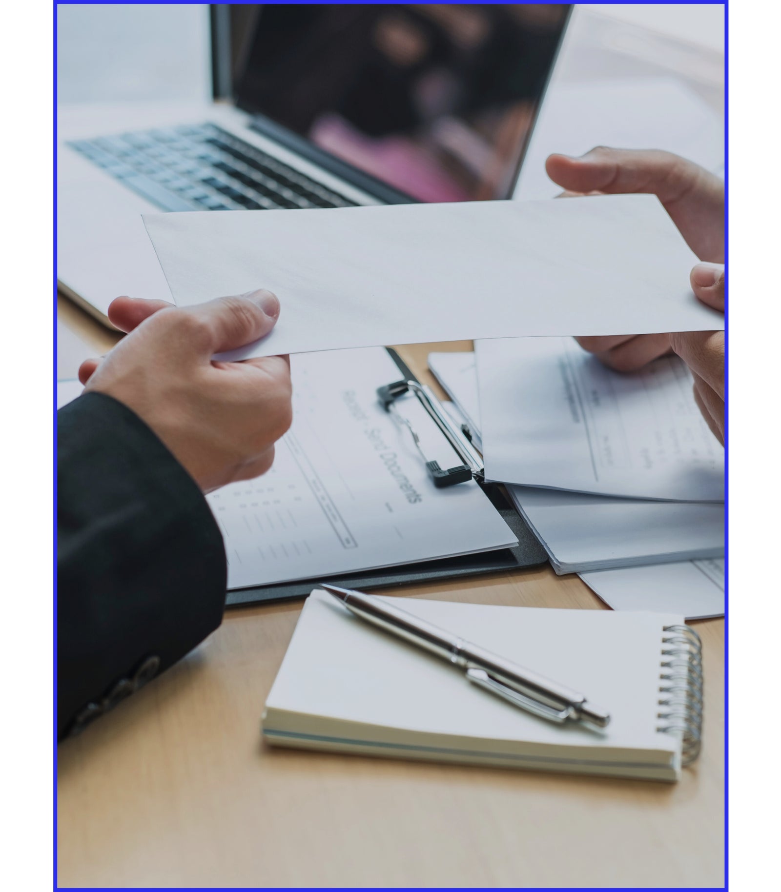 handing over an envelope